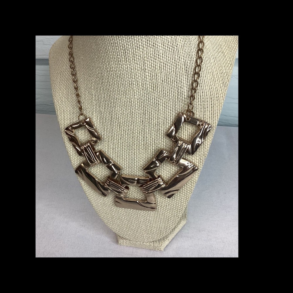 Gold statement, piece necklace.